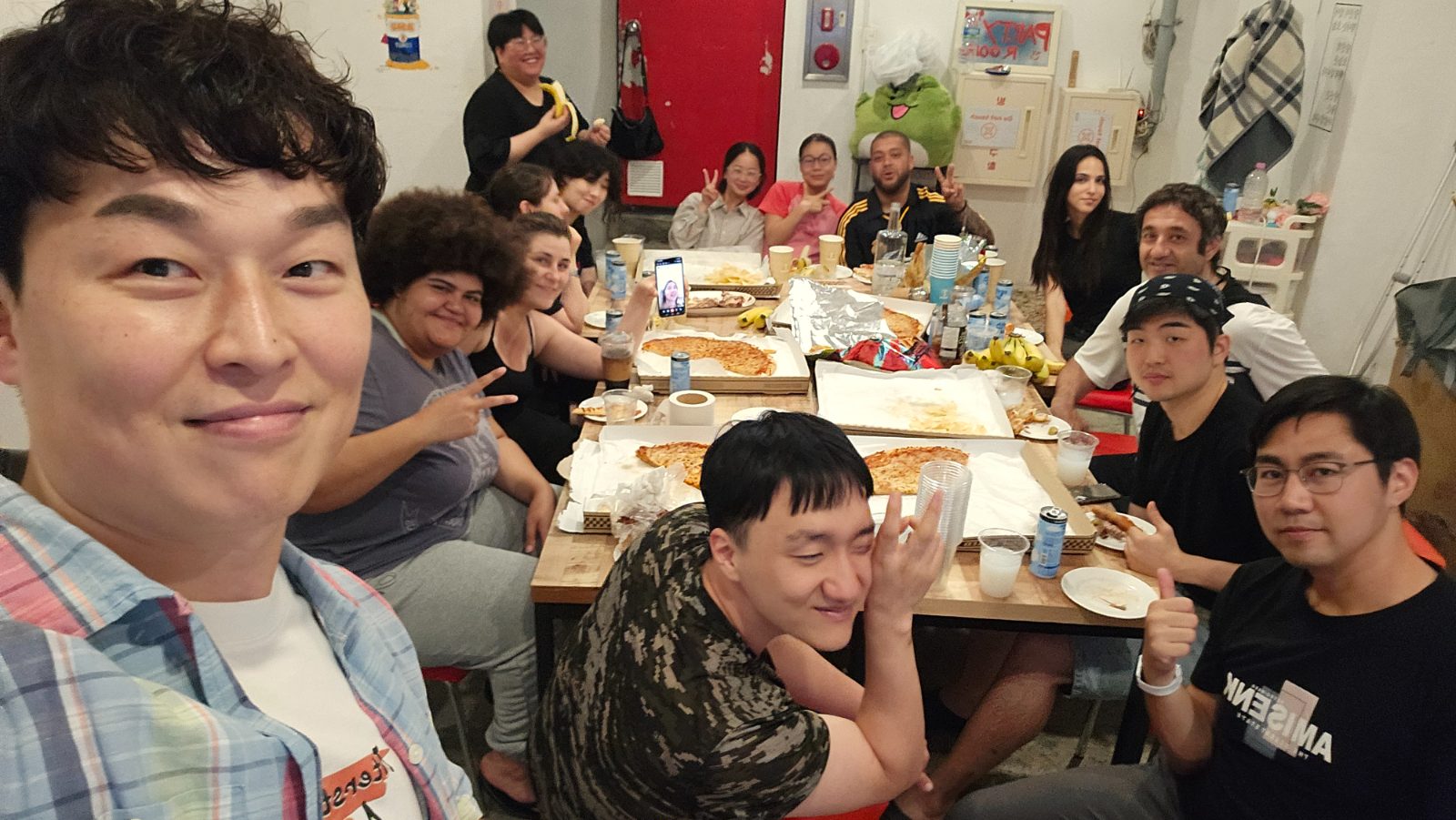 Travelers sharing a Korean meal at a guesthouse