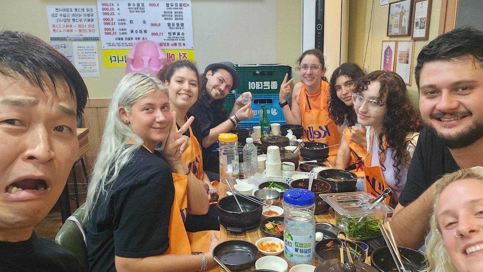 Guests cooking Korean food together in the shared kitchen