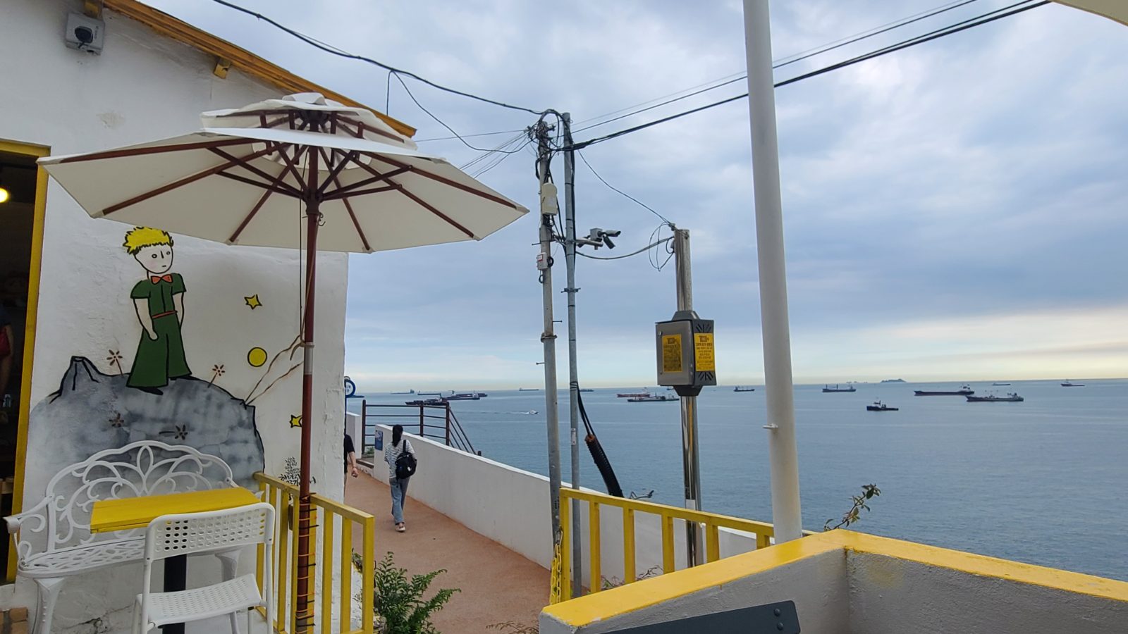 A summer day in Busan with a beach, market and coffee spot near Yeongdo island, a taste of the city's wet heat.